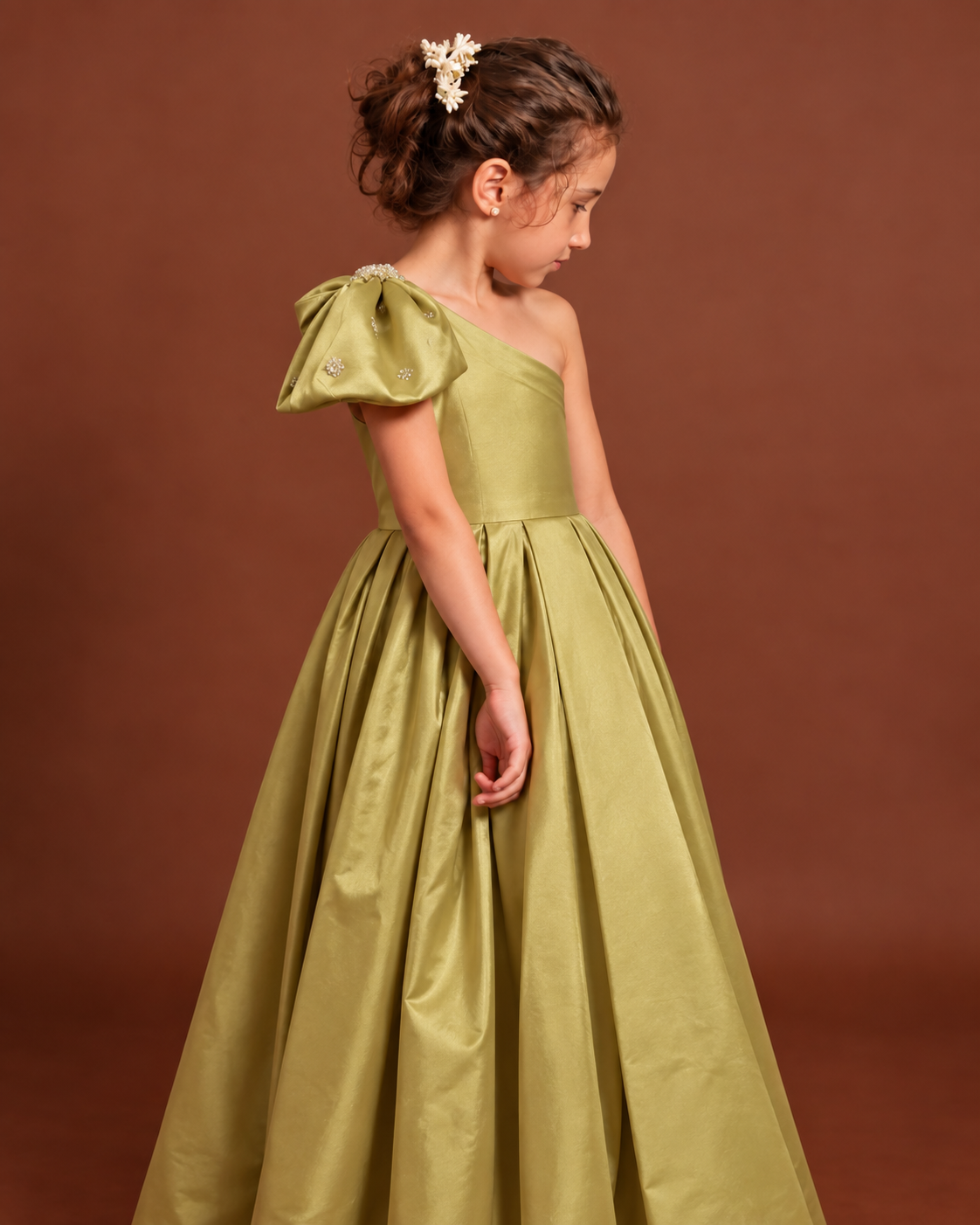 Side view of Olive Gold Satin Gown showing embellished shoulder bow
